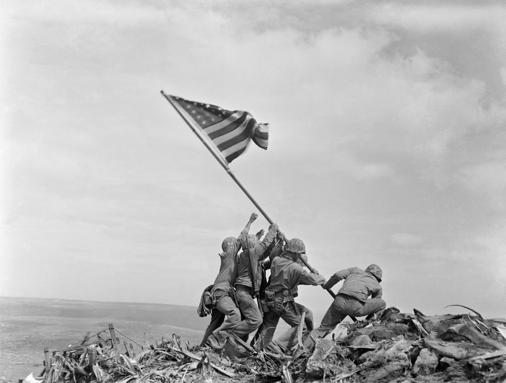 Which of these statements about the famous photograph of the U.S. flag being raised on Iwo Jima is false?