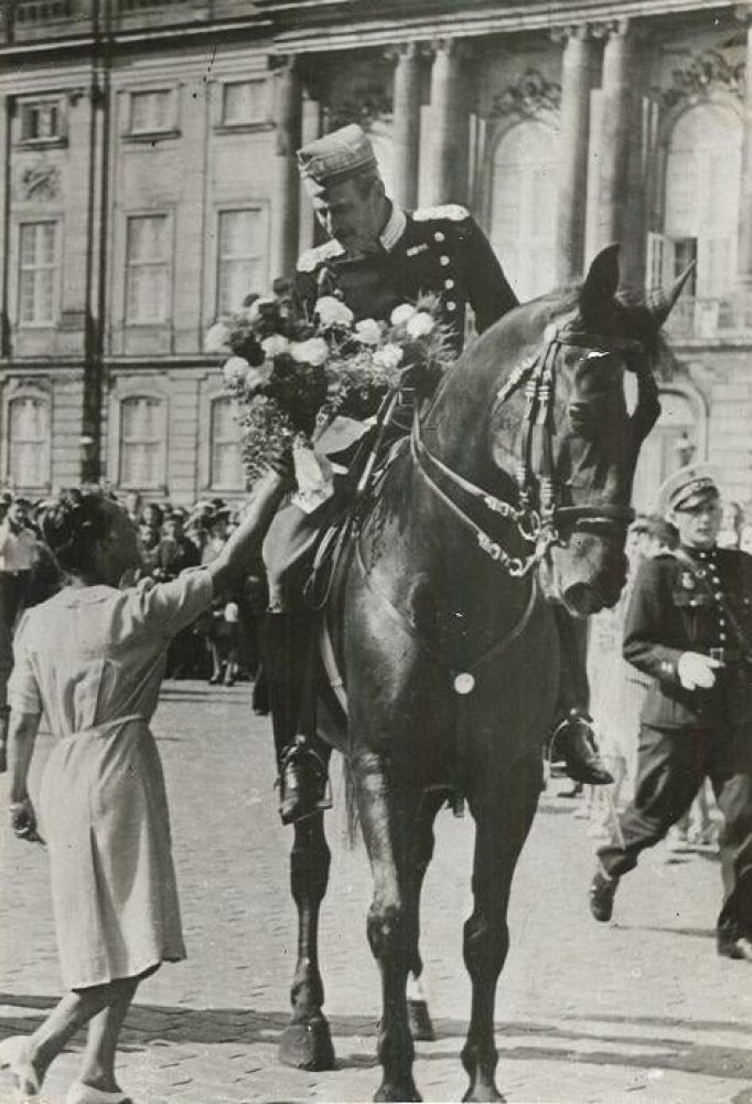 Which European king became a symbol of resistance by remaining in his country after it fell to the Nazis and taking daily horse rides in the capital city unguarded (until he fell, and the injury prevented him from continuing the practice)?