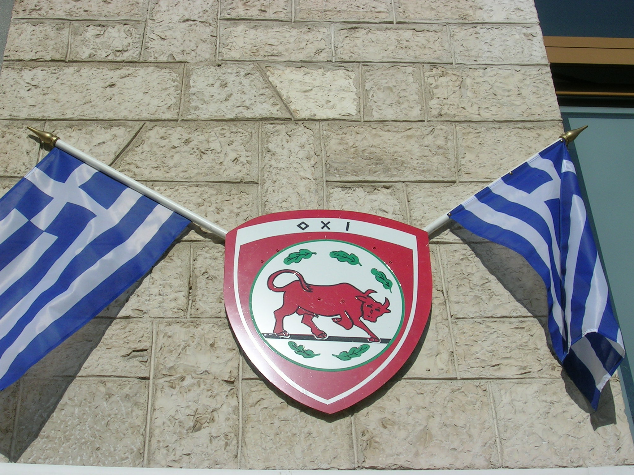 “Ohi!” (spelled “OXI” in Greek) was a common Greek battle cry during the Italian invasion of Greece in World War II, and is memorialized to this day with “Ohi Day” on October 28. What does the word mean?