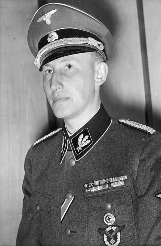 Prominent Nazi official Reinhard Heydrich was assassinated by British-trained Czechoslovakian agents in Prague in May 1942. What weapon caused the wounds he eventually died of?