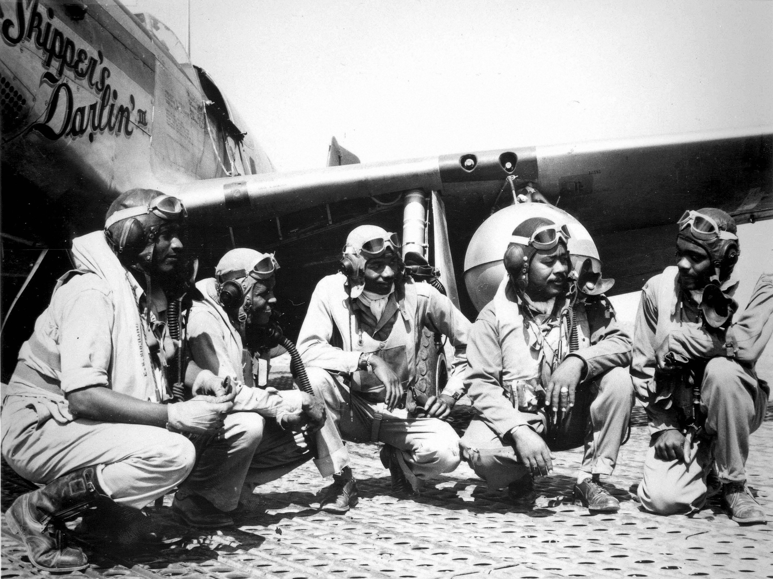 Where did the black aviators of the famous Tuskegee Airmen flow their first combat missions from?