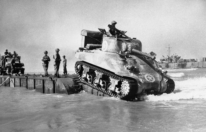 What were the names of the first two U.S. amphibious task forces to land on the shores of Sicily in the early hours of July 10, 1943, during the beginning of Operation Husky? 