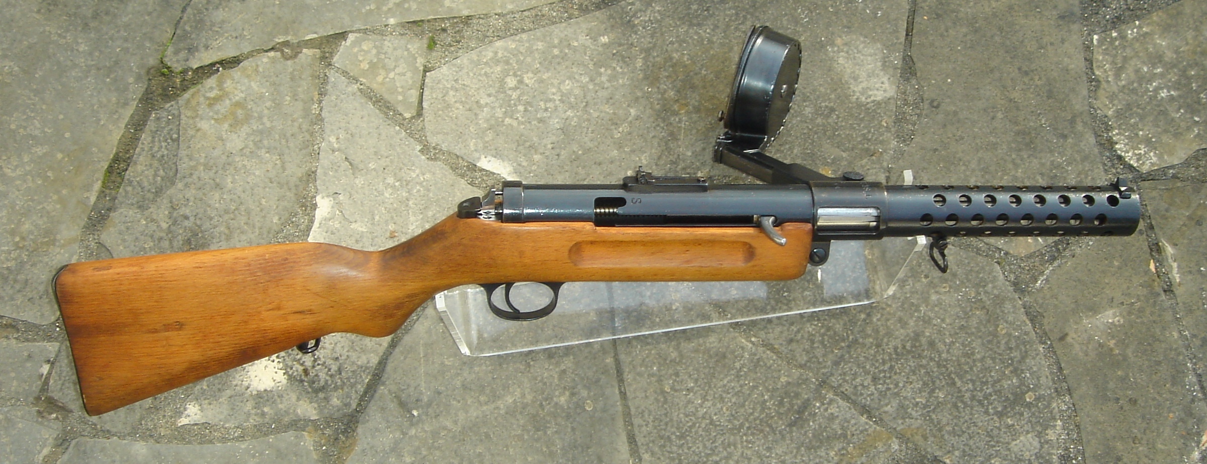 Can you identify this early submachine gun that was originally designed for World War I but ended up also seeing action in World War II?