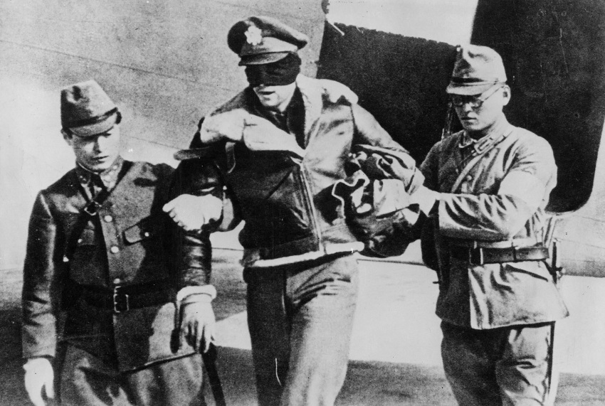 Which World War II belligerent nation passed an “Enemy Airmen’s Act,” a law that stated that enemy air crews who participated in bombing missions have violated the “law of war,” and could therefore be tried and punished on capture? (Note: photo does not necessarily depict the correct answer.)