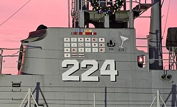 The submarine USS Cod has an unusual mark on her battle flag, a martini glass. What does the symbol commemorate?