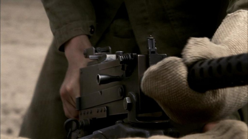 Why were Browning  M1919 machine gunners told to reach for the charging handle palm up, with thumb away from the gun?