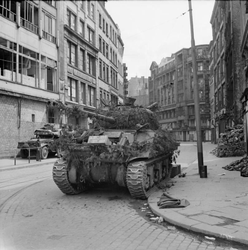 What was the designation of a Sherman tank up-gunned with a British 17-pounder gun capable of taking out German heavy tanks?